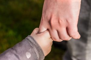 Father Holding Childs Hand
