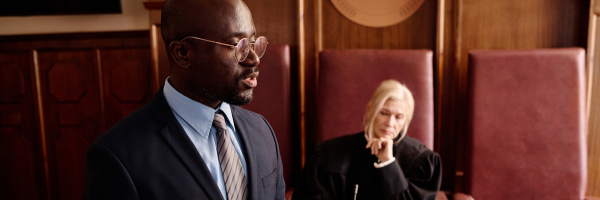 a black lawyer speaks in a courtroom