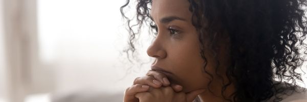 a mixed race woman looking concerned