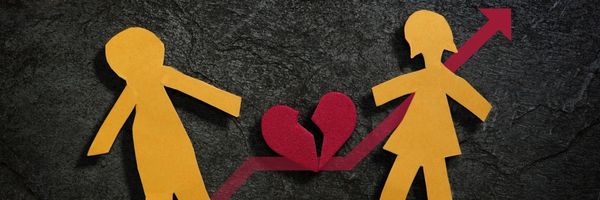 Two paper cutout figures with a broken heart and an upward arrow between them on a dark textured background. From Lawrence Law Firm New Jersey Family Lawyer.
