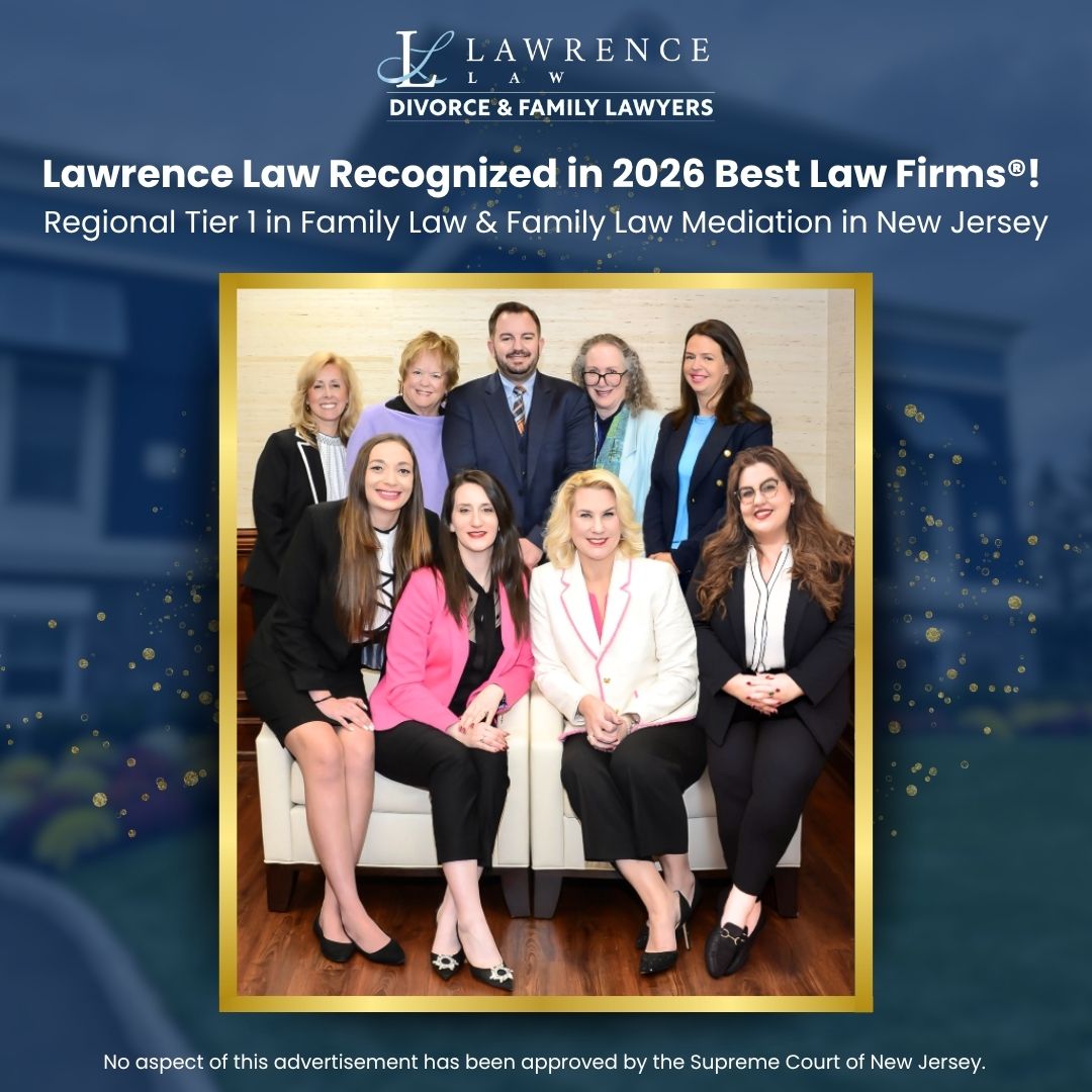 A group of eight professionally dressed people pose indoors in front of a blue wall and signage for Lawrence Law, honored as one of the 2026 Best Law Firms for family law in New Jersey. From Lawrence Law Firm New Jersey Family Lawyer.