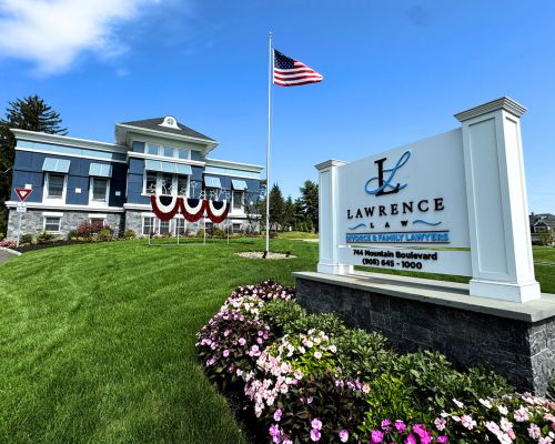 A law office building with an American flag, a sign reading 